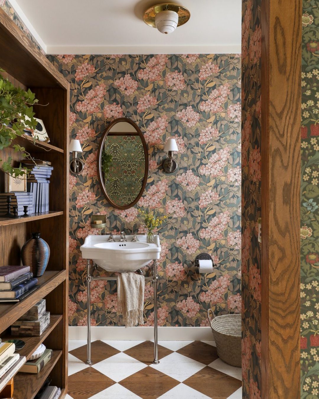 Oval Mirror with Wood Frame Above Pedestal Sink