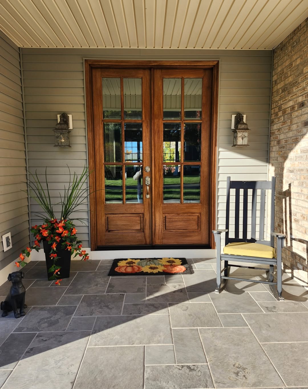 Dark Rocking Chair Adds Seating Next to Wood Doors
