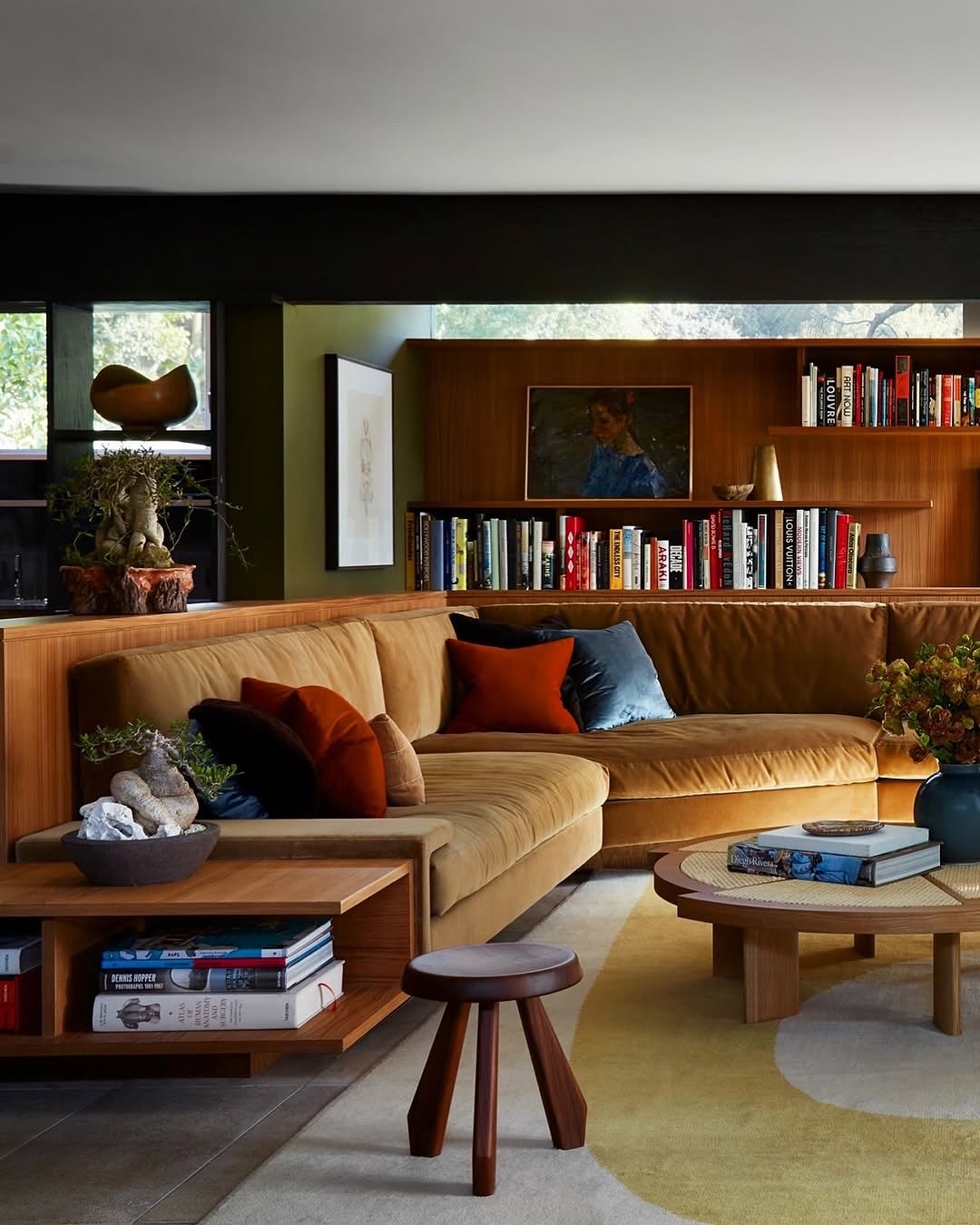 Incorporate a Sculptural Wooden Stool Beside the Sofa