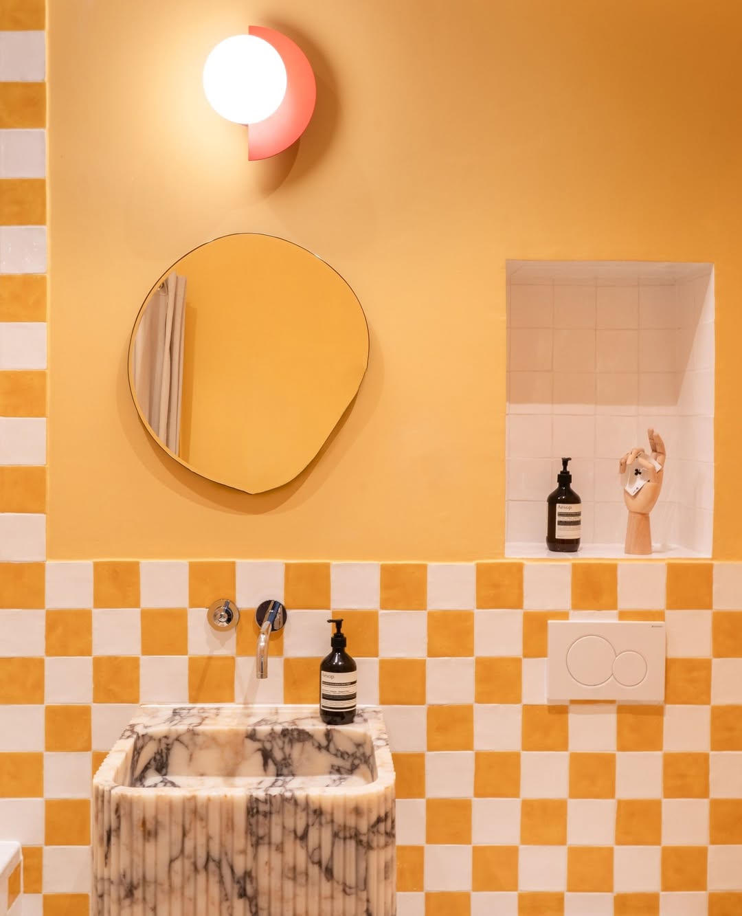 Marble Sink Adds Sculptural Detail to Checkerboard Tile