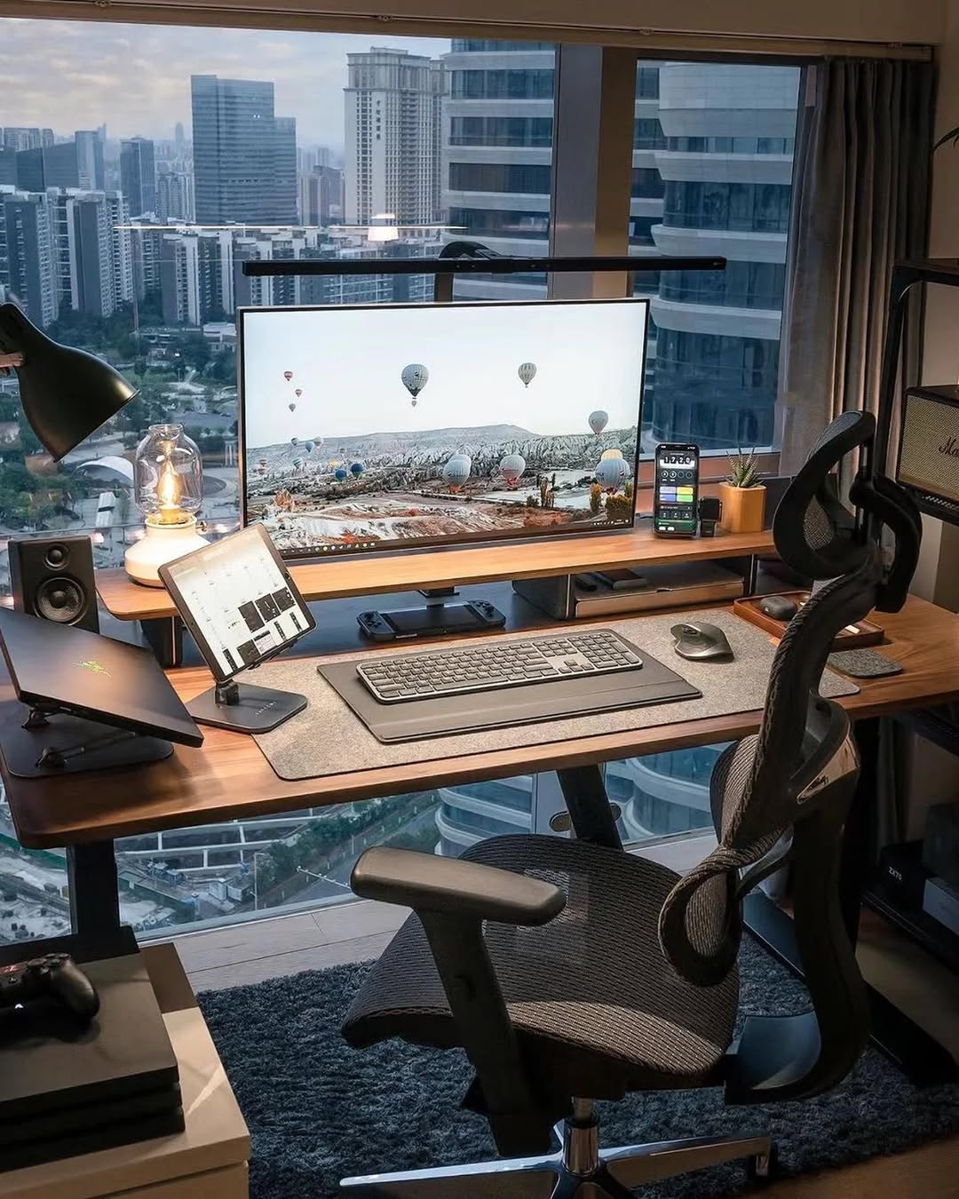 Keep Your Phone Accessible with a Monitor Stand's Integrated Holder