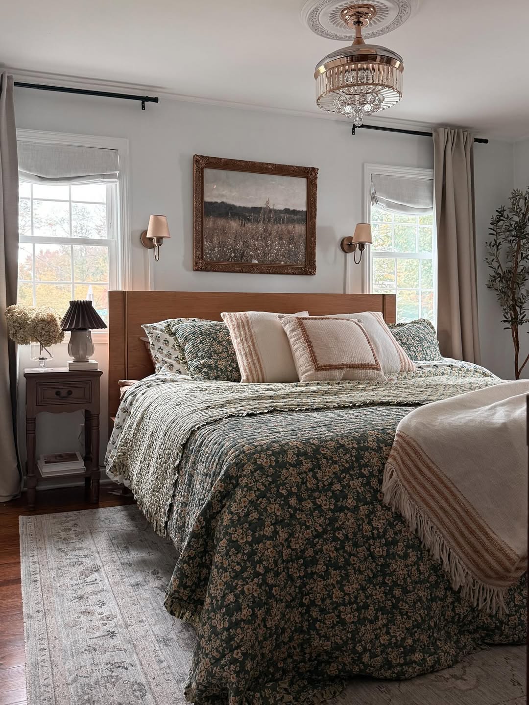 Framed Landscape Painting Adds Rustic Charm Above Bed
