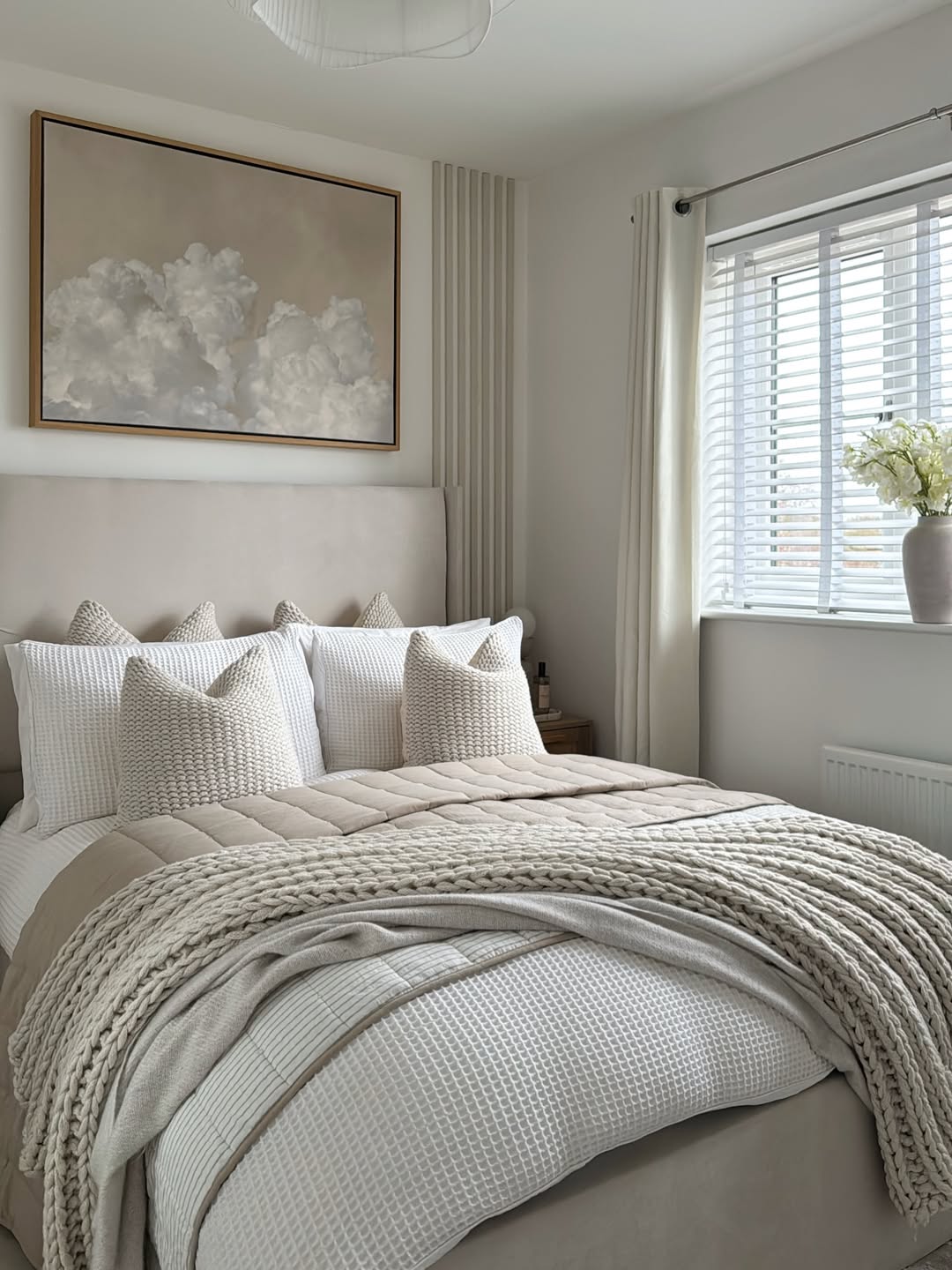 Oversized Cloud Art Adds Soft Texture Above Bed