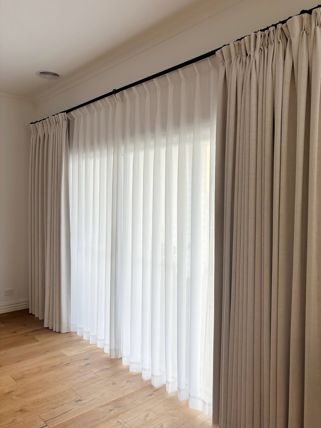 Layer Sheer Curtains Over Drapes for Soft, Diffused Light