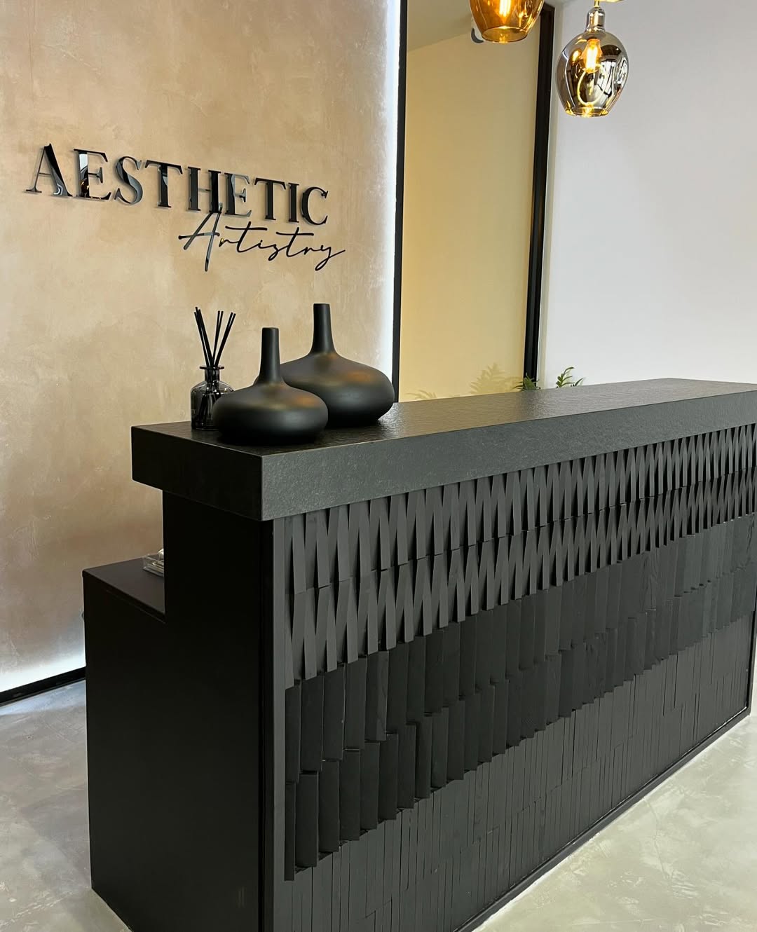 Black Front Desk with Layered Geometric Wood Panels