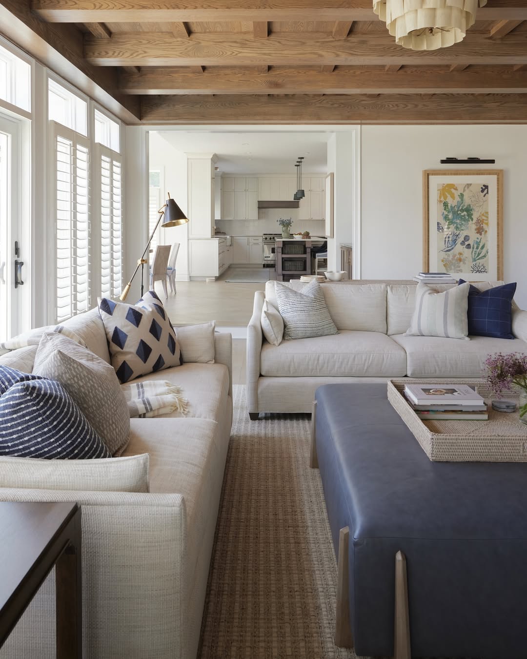 Navy Leather Ottoman Anchors Seating Area With Natural Tray