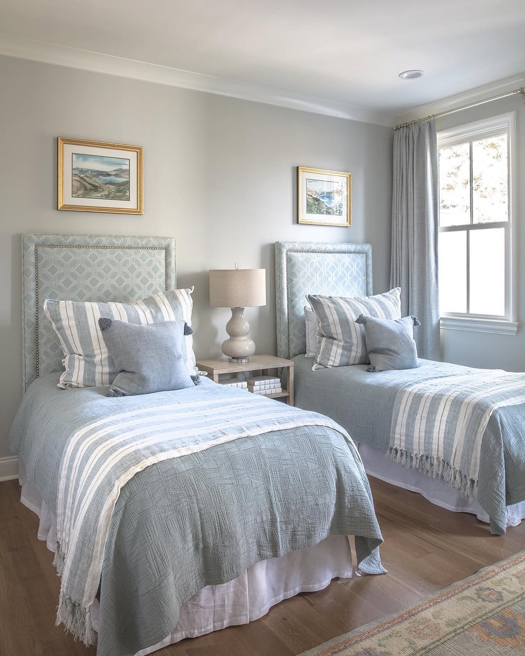 Patterned Upholstered Headboards Add Softness Above Twin Beds