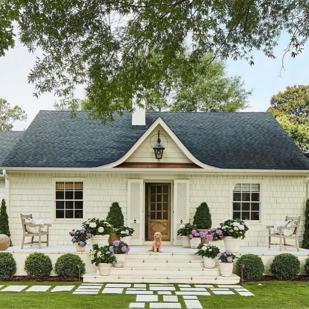 White Planters Create Layered Floral Displays on Steps