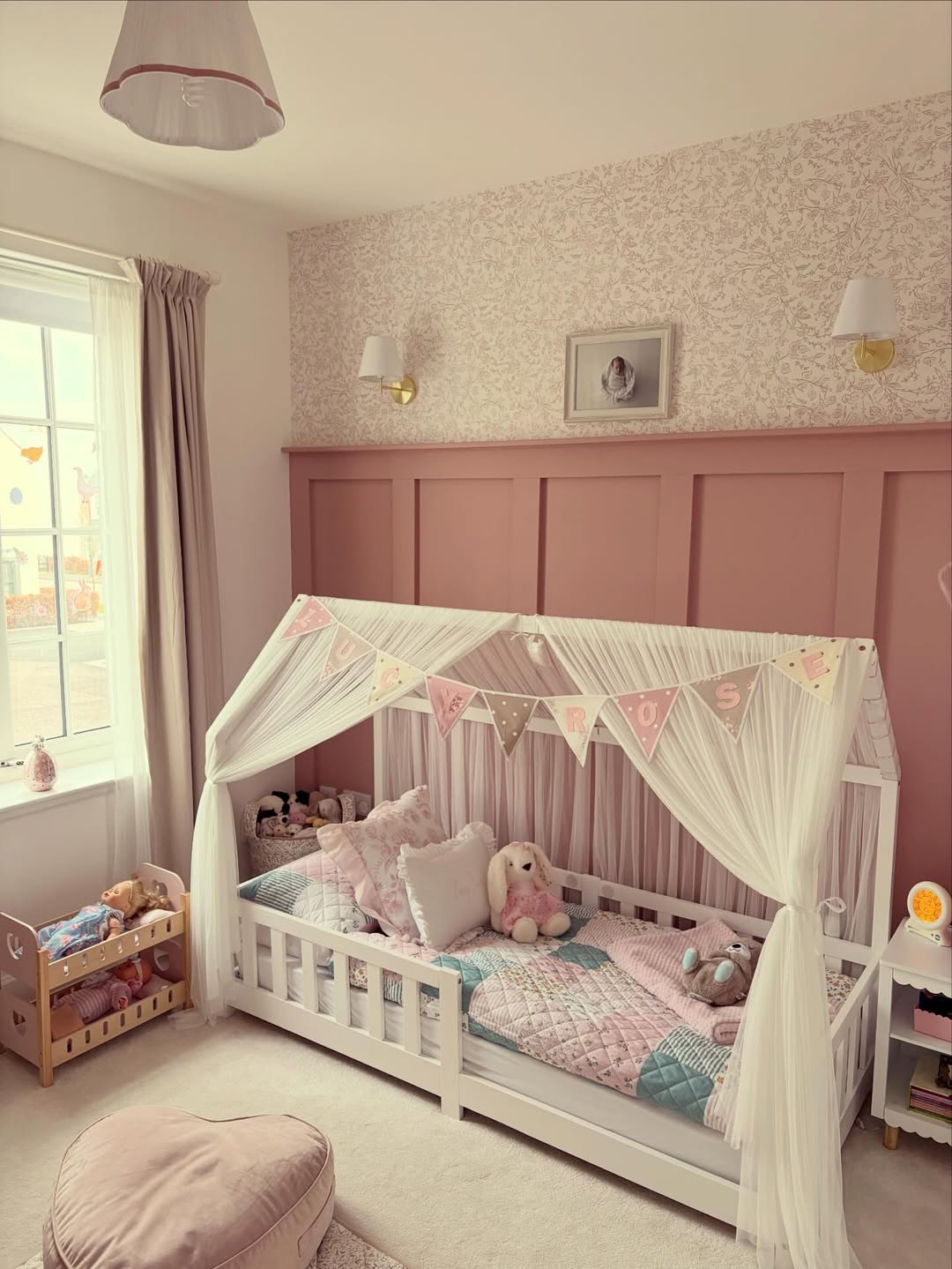 Canopy Bed with Bunting Adds Whimsical Flair