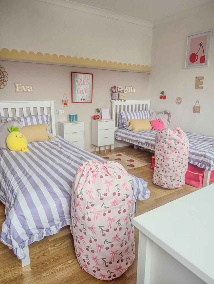Cherry-Print Laundry Bags Add Playful Storage Beside Beds