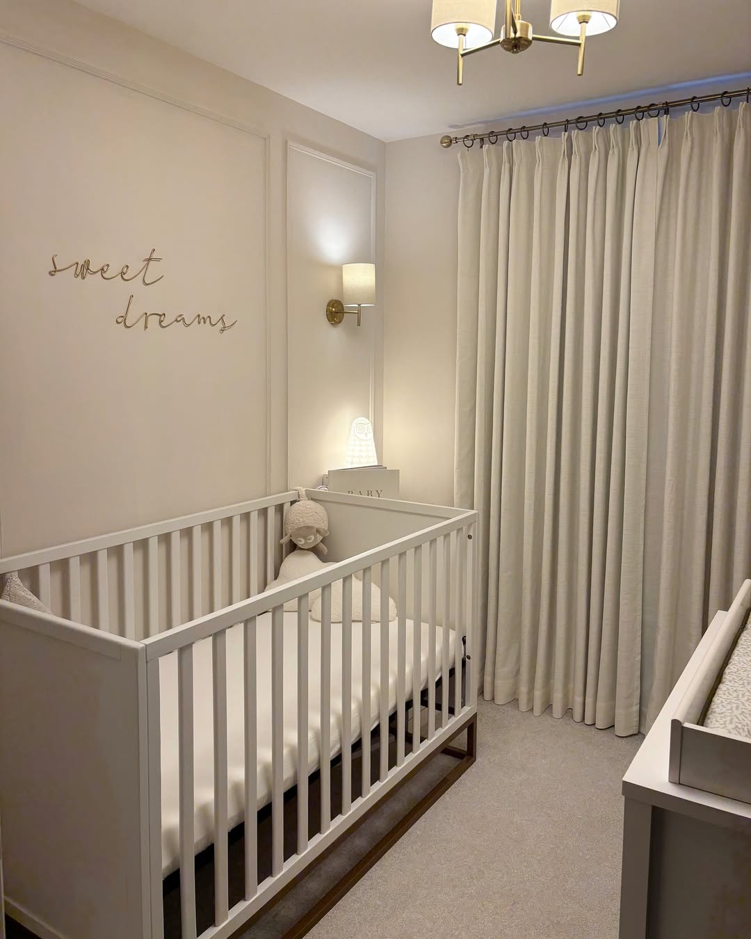 Textured Cream Curtains Soften a Nursery Corner
