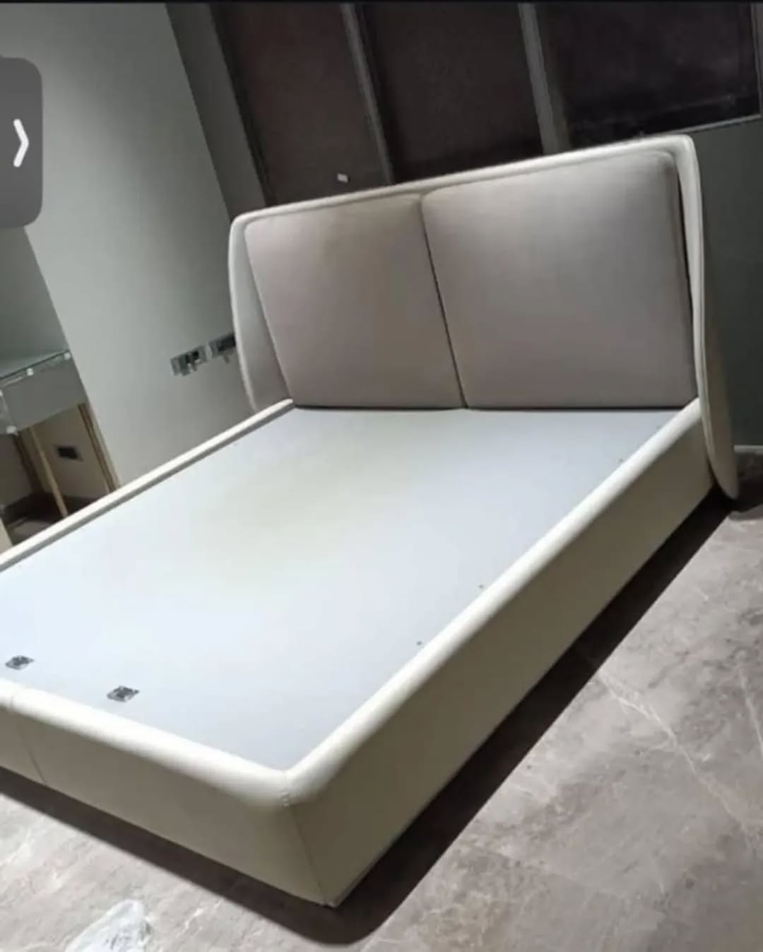 Upholstered Bed Frame with a Curved Wingback Headboard