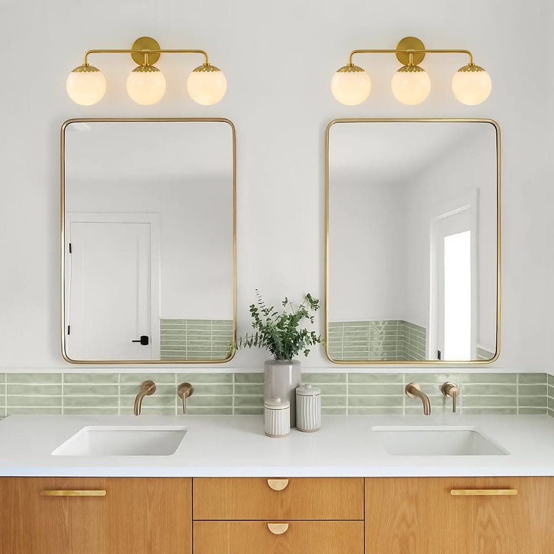 Brass Vanity Lights Add a Warm Glow Above Mirrors