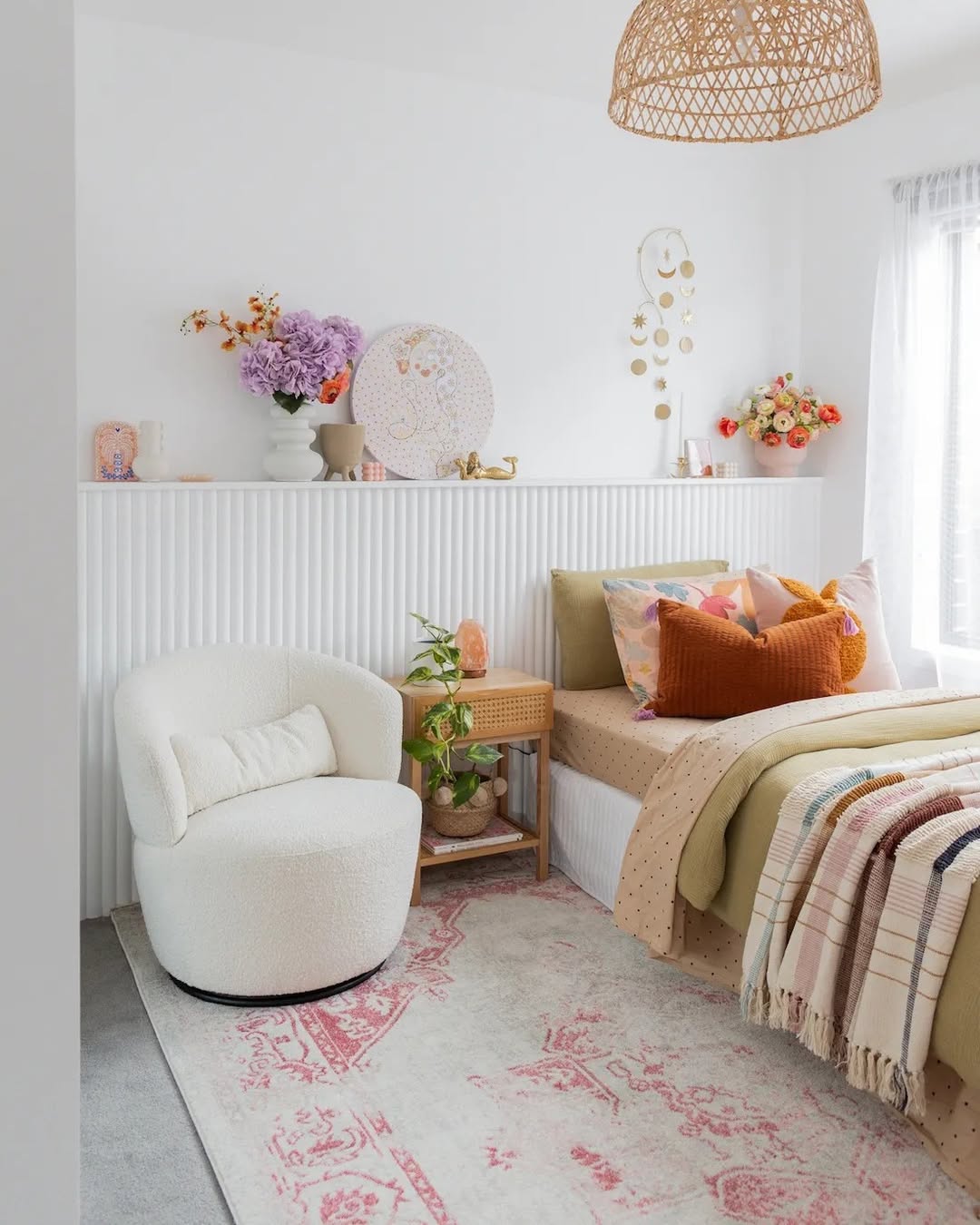 White Fluted Wall Adds Dimension Behind a Cozy Reading Nook