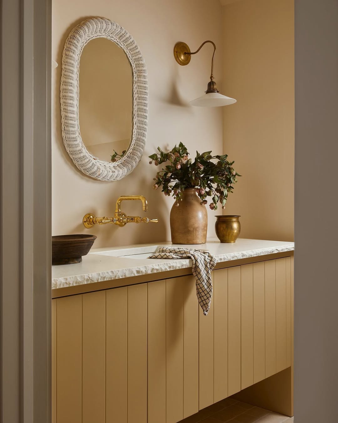 Woven Mirror Frame Adds Natural Texture Above Vanity