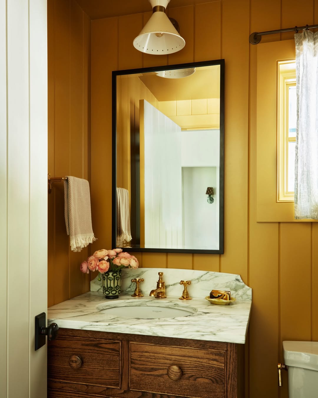 Gold Faucet and Drawer Pulls Warm Up Yellow Walls