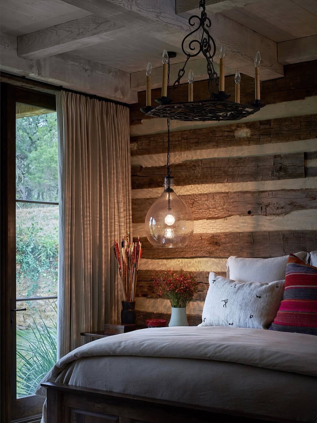 Layer Lighting with an Ornate Chandelier and Glass Pendant