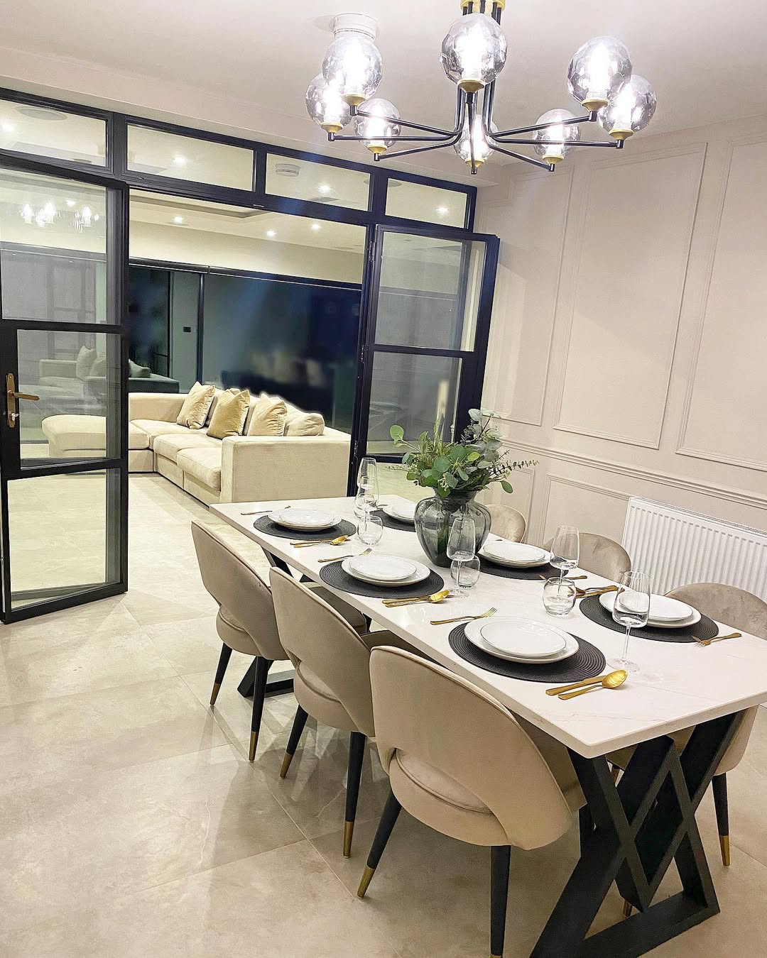 Channeled Velvet Chairs Soften a Modern Dining Table