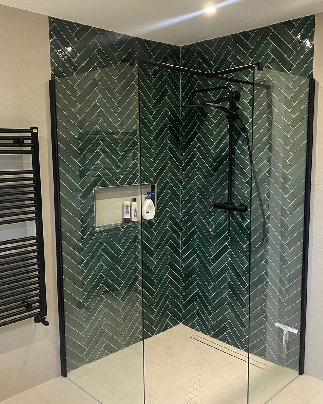 Deep Green Herringbone Tile Creates a Moody Shower