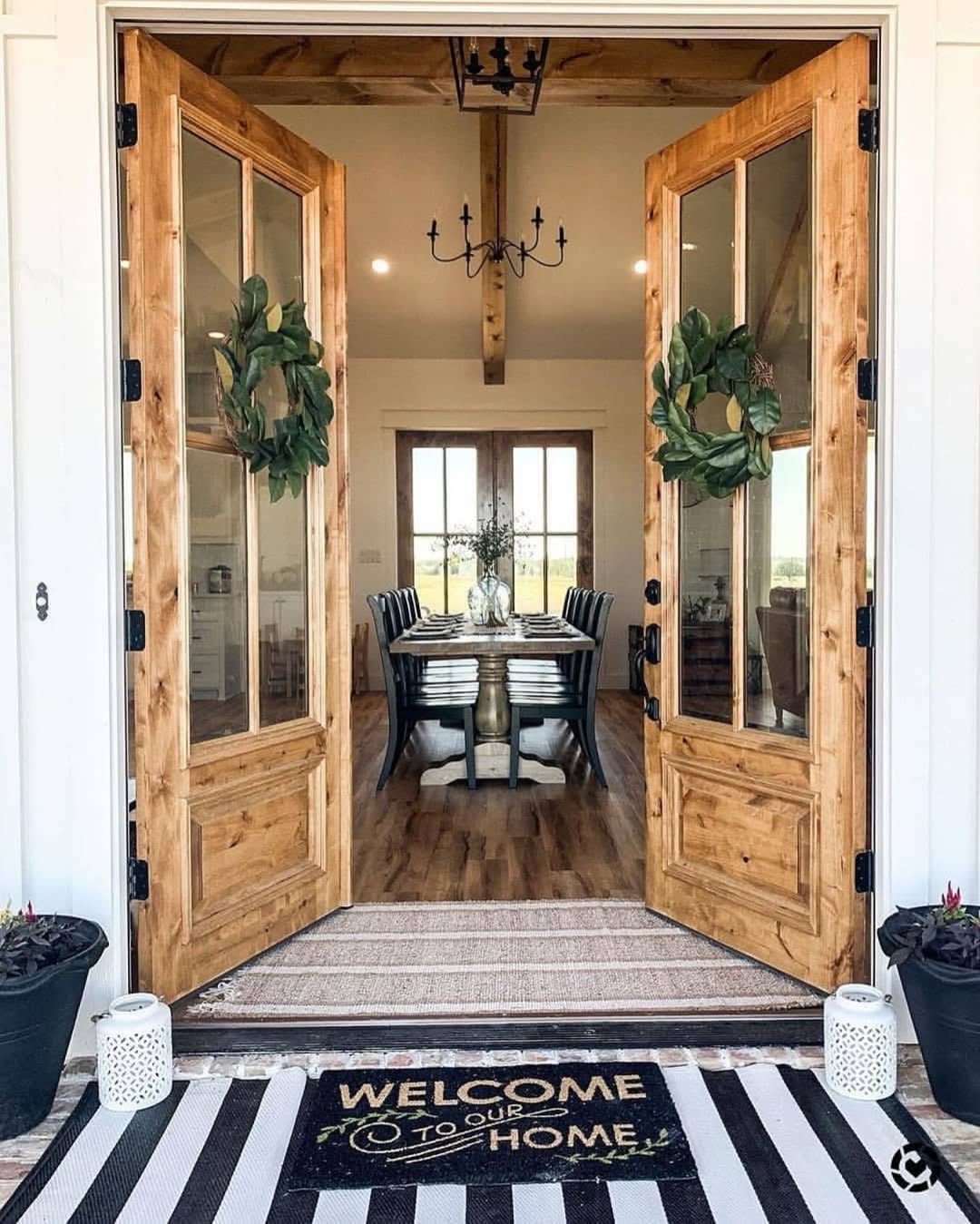 Magnolia Wreaths Add Natural Symmetry to Glass Paned Doors