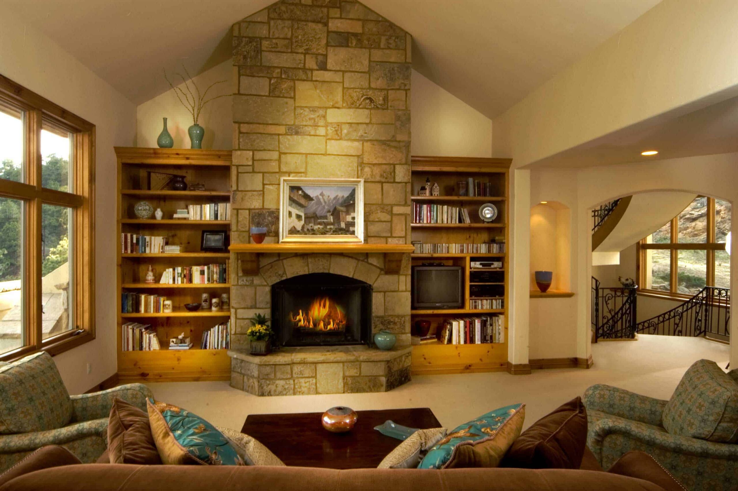 Built-in Bookshelves Flank Stone Fireplace for Storage and Style