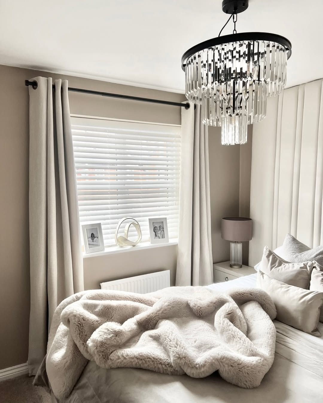 Layer Neutral Curtains Over White Blinds for Soft Light