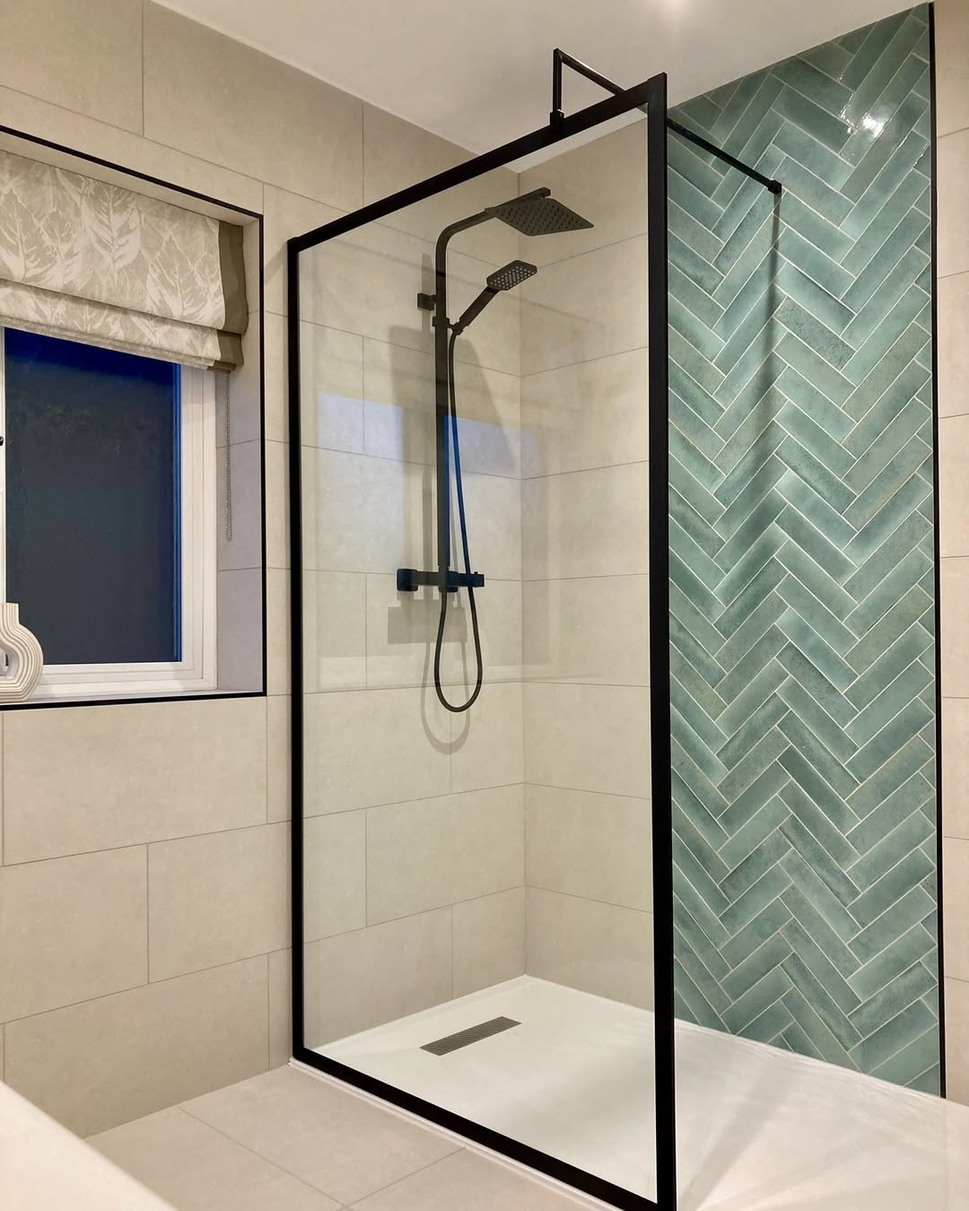 Mint Green Herringbone Tile Adds Playful Texture to Shower Walls