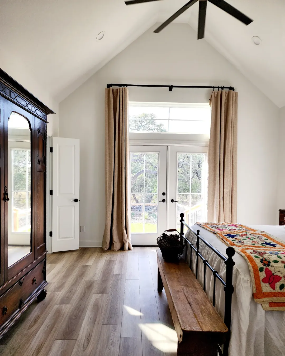 Wooden Bench Adds Rustic Charm at the Foot of the Bed