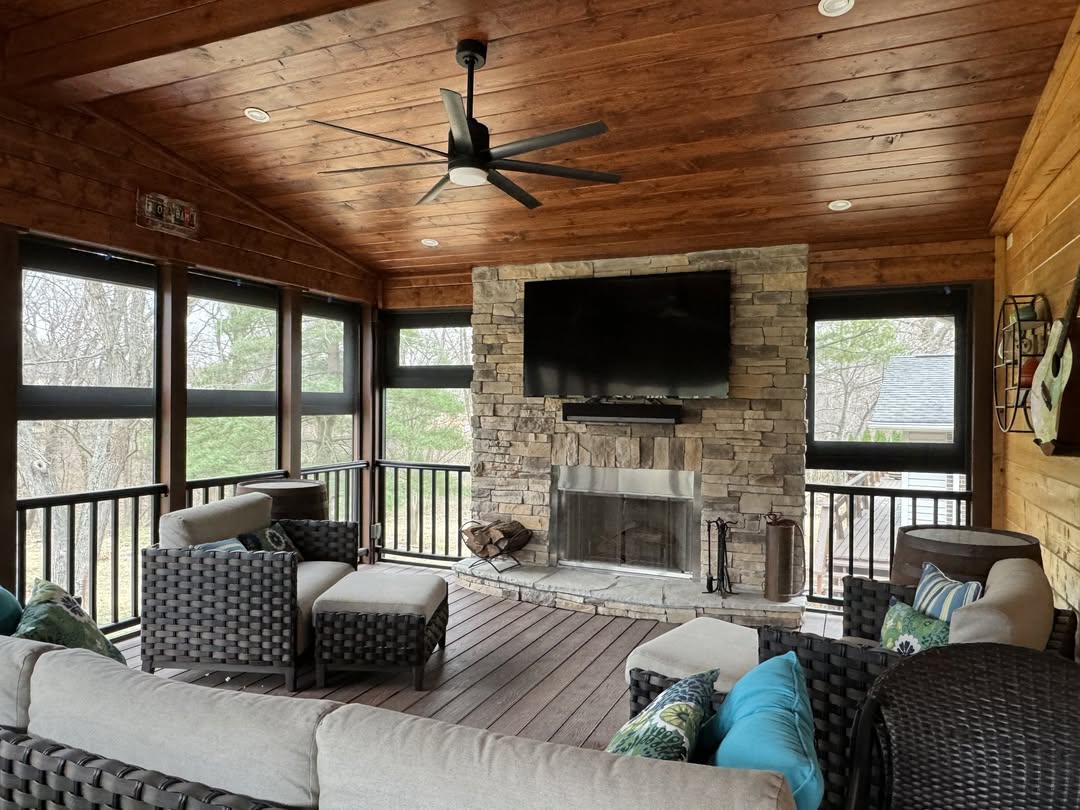 Stone Fireplace Anchors Cozy Porch Seating Area