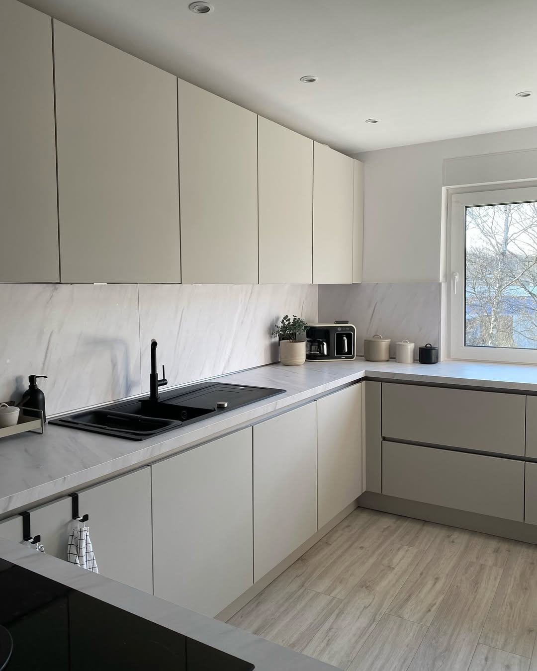 Achieve a Streamlined Look with Matte Beige Cabinets
