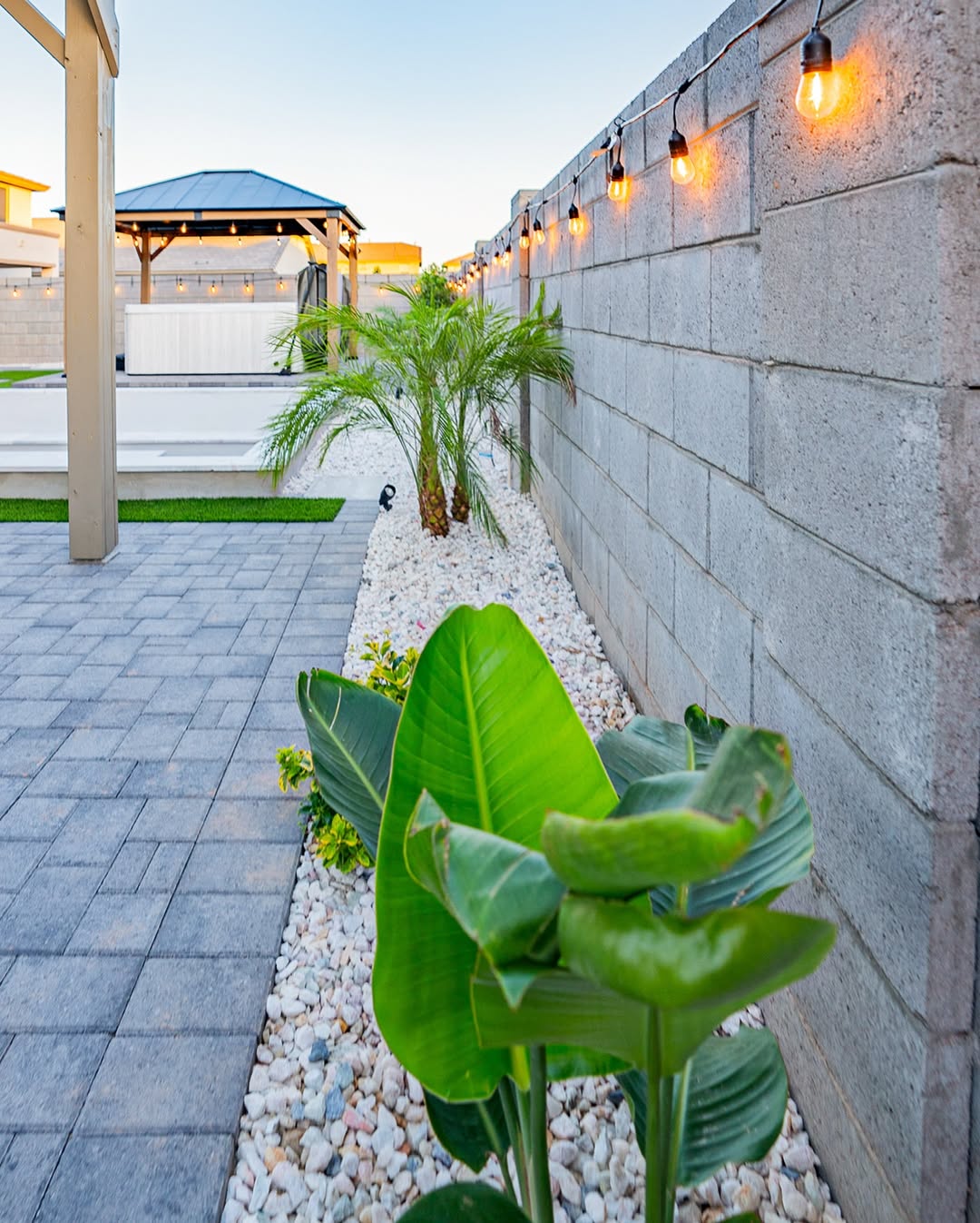 White Rock Borders That Contrast With Large Green Leaves