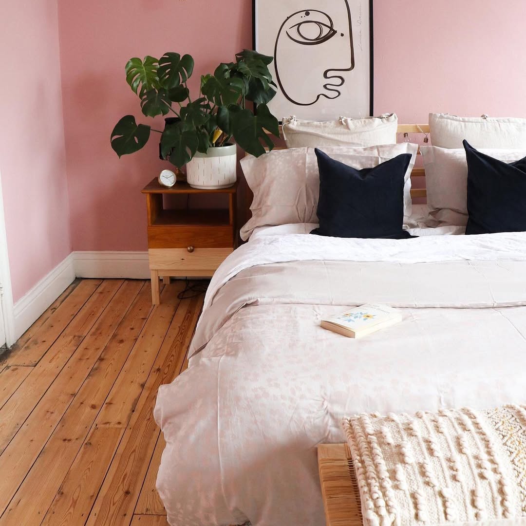 Wooden Nightstand With Open Shelf Holds a Large Potted Plant