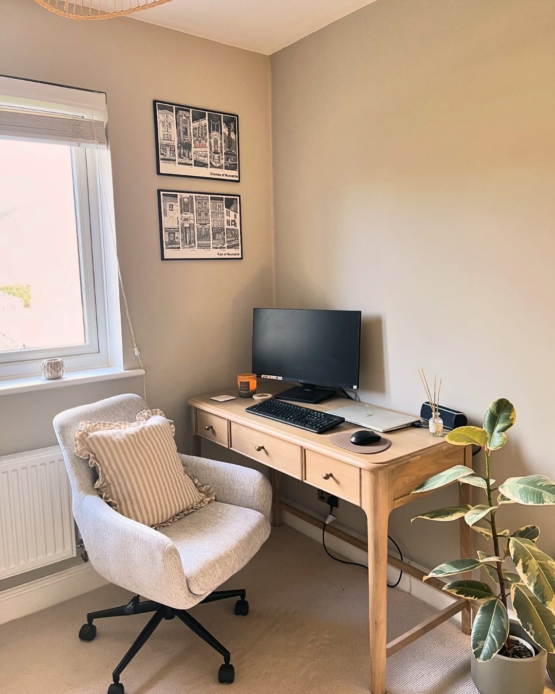 Stacked Artwork Adds Personality Above a Simple Desk