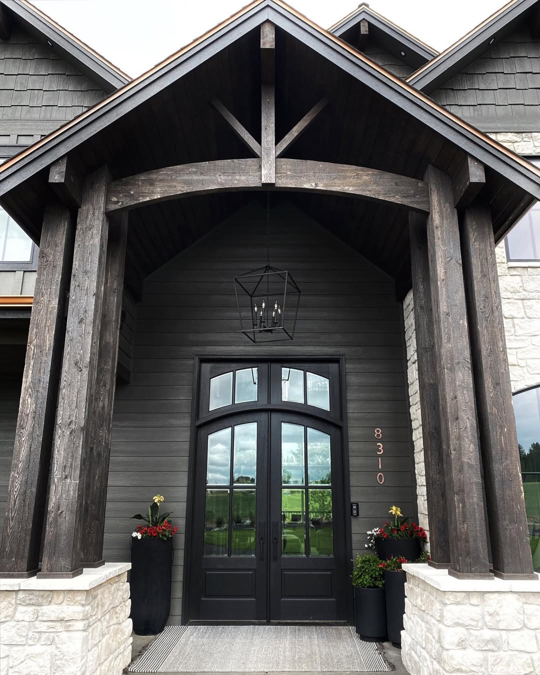 Tall Black Planters Add Dramatic Flair to Entryways