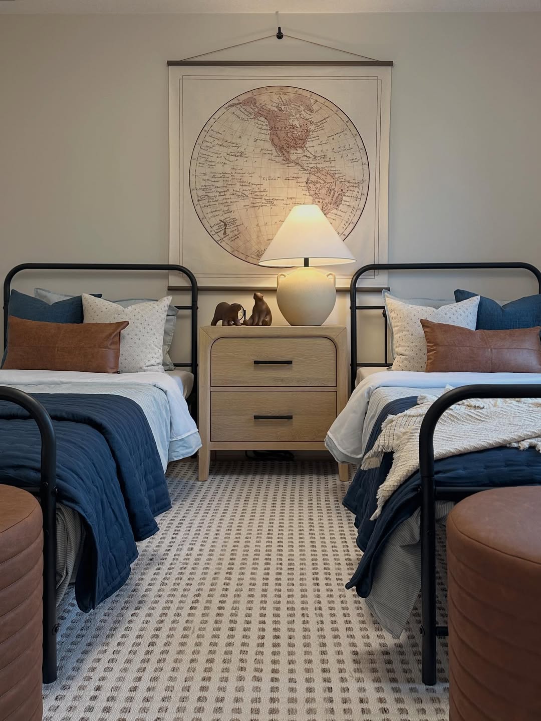Large Vintage World Map Adds Educational Decor Above Beds