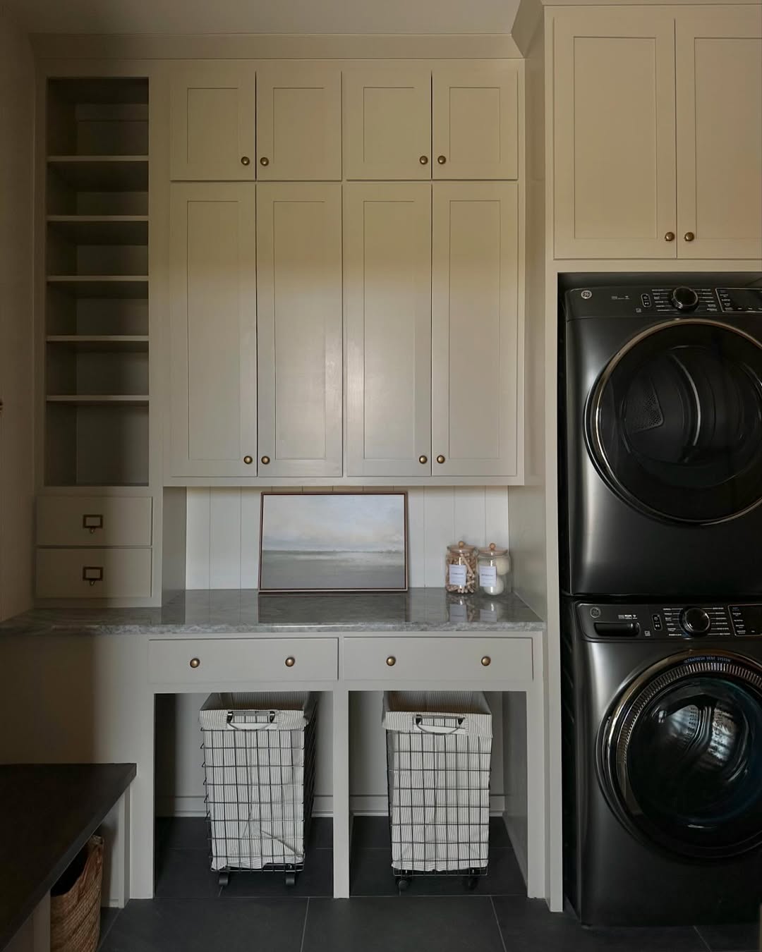 Rolling Baskets Tucked Under a Countertop for Laundry Sorting