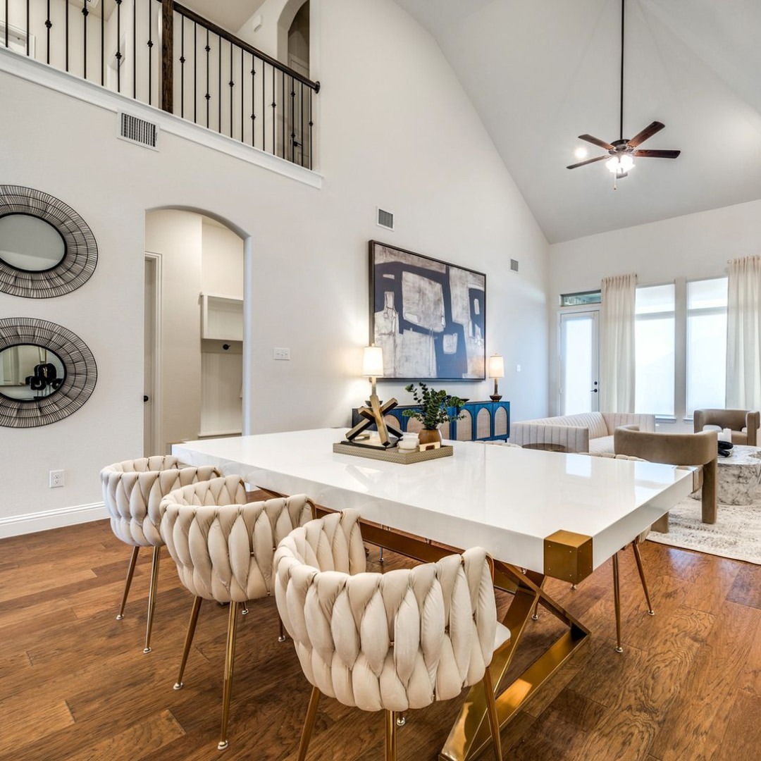 Glamorous Gold X-Base Legs Elevate a White Dining Table