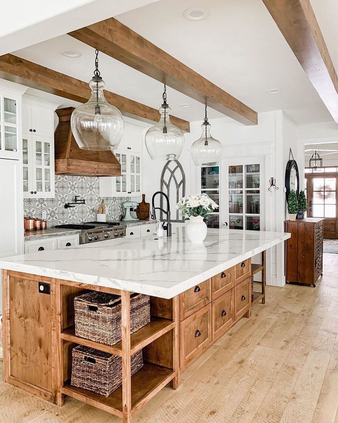Glass Pendant Lights Hang From Exposed Wood Beams