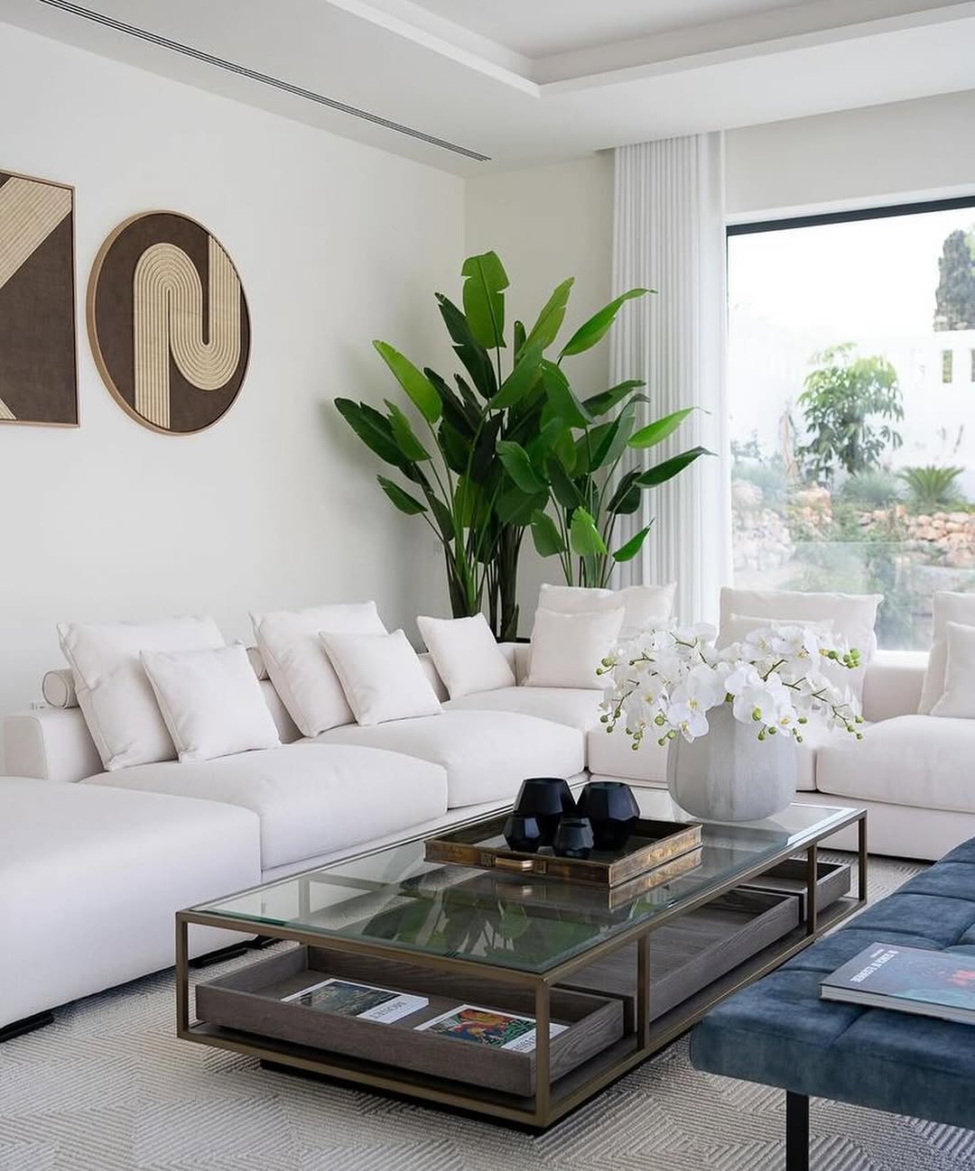 Utilize a Two-Tiered Glass Coffee Table for Display