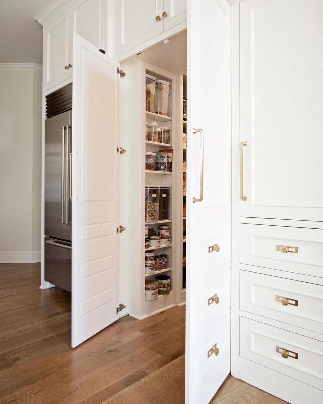 Cabinetry Door Hides a Deep Kitchen Pantry