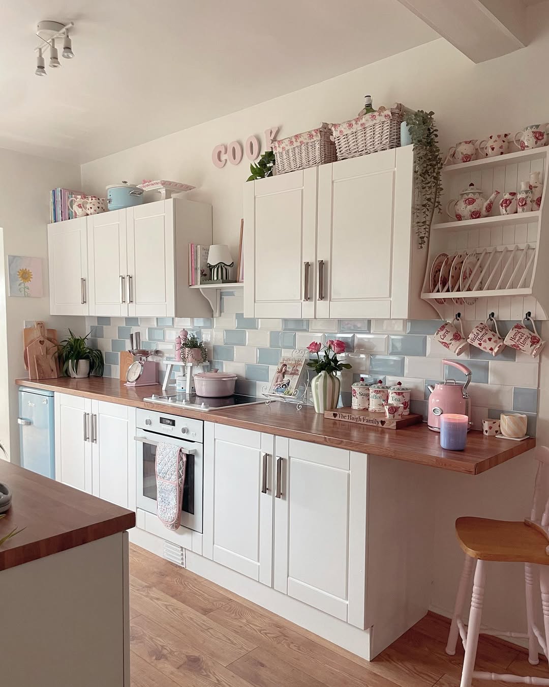 White Open Shelving Unit for Displaying Mugs and Plates