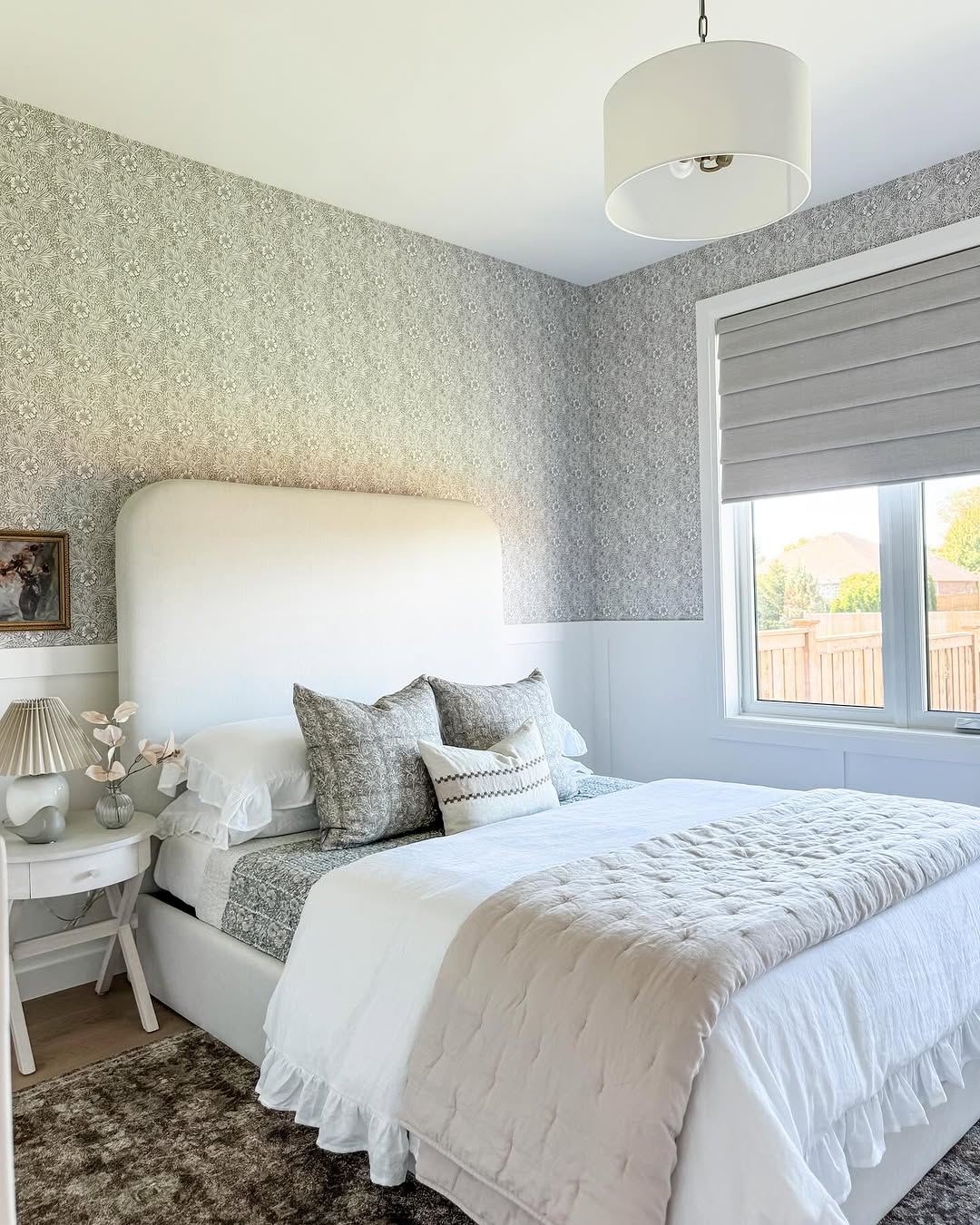 Patterned Wallpaper Anchors a Soft, Neutral Bedroom