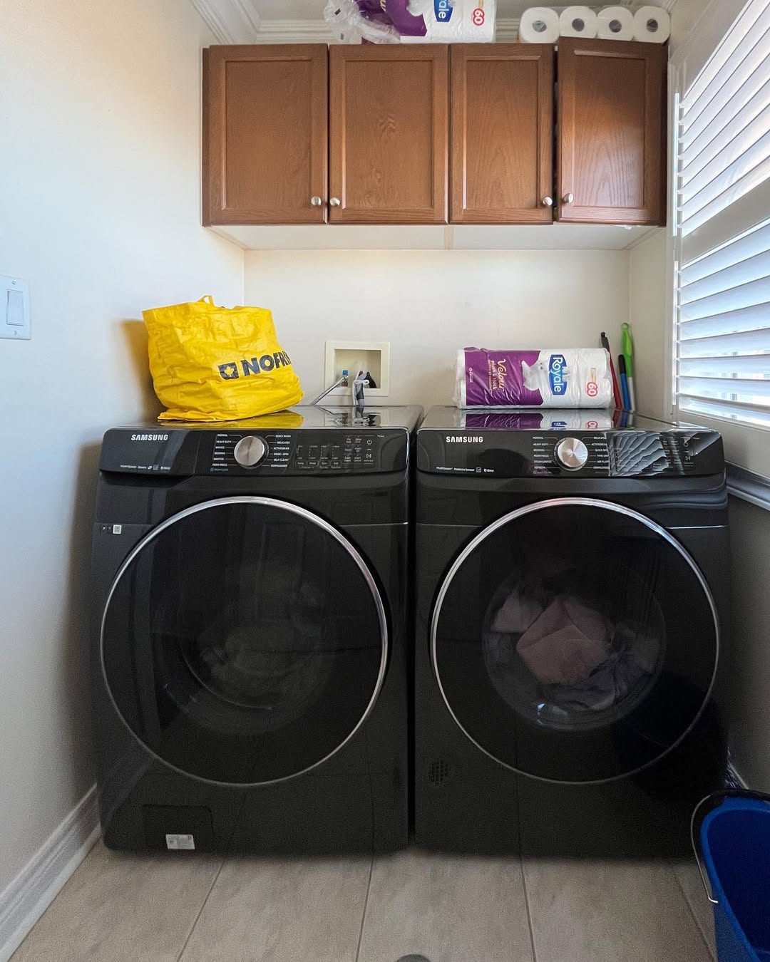 Wooden Cabinets Above Machines Store Bulk Toilet Paper