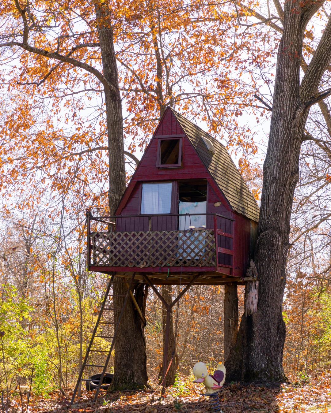 A-Frame Treehouse with Decorative Lattice Railing