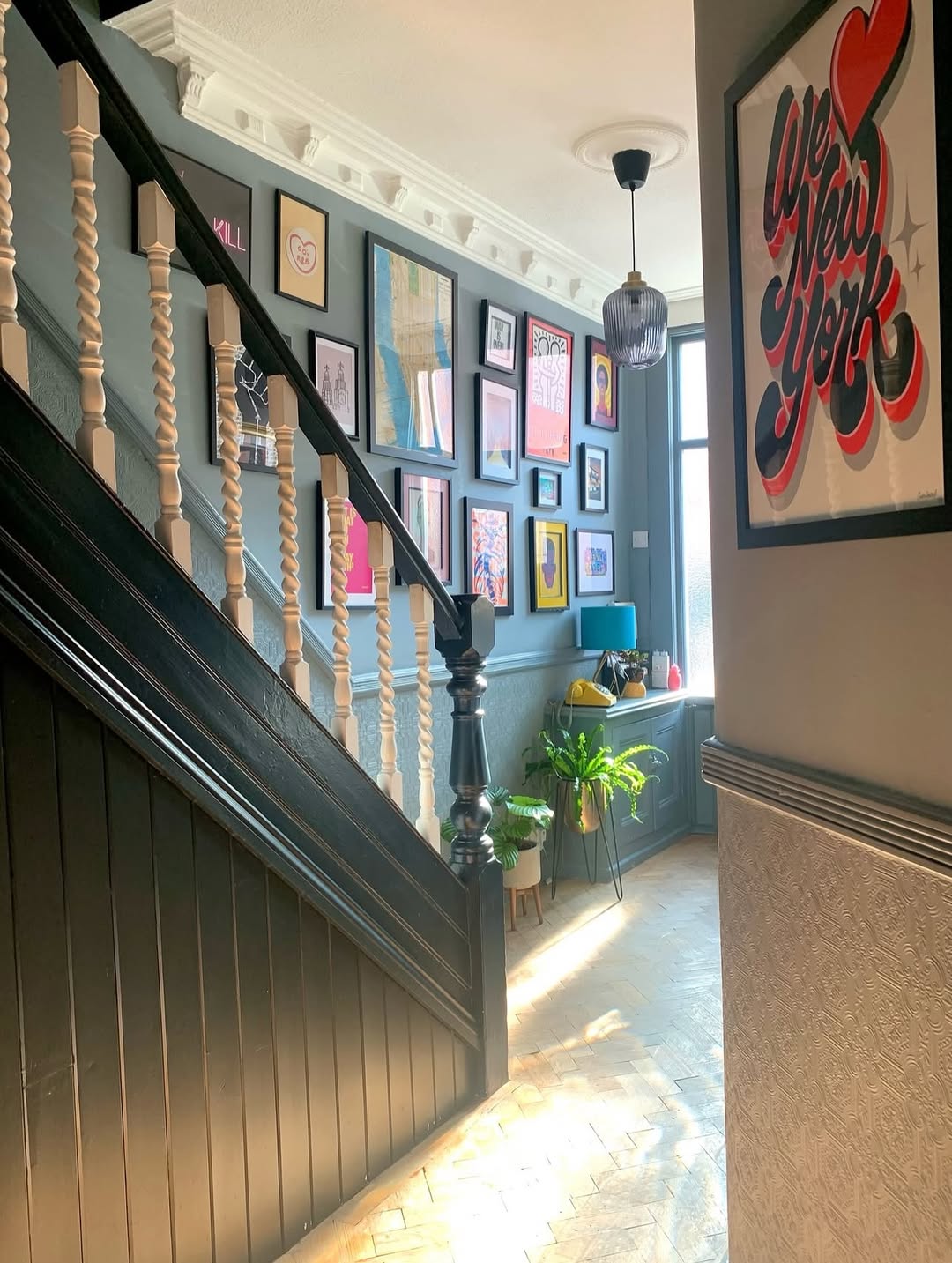 Gallery Wall With Varied Frame Sizes Adds Dynamic Interest