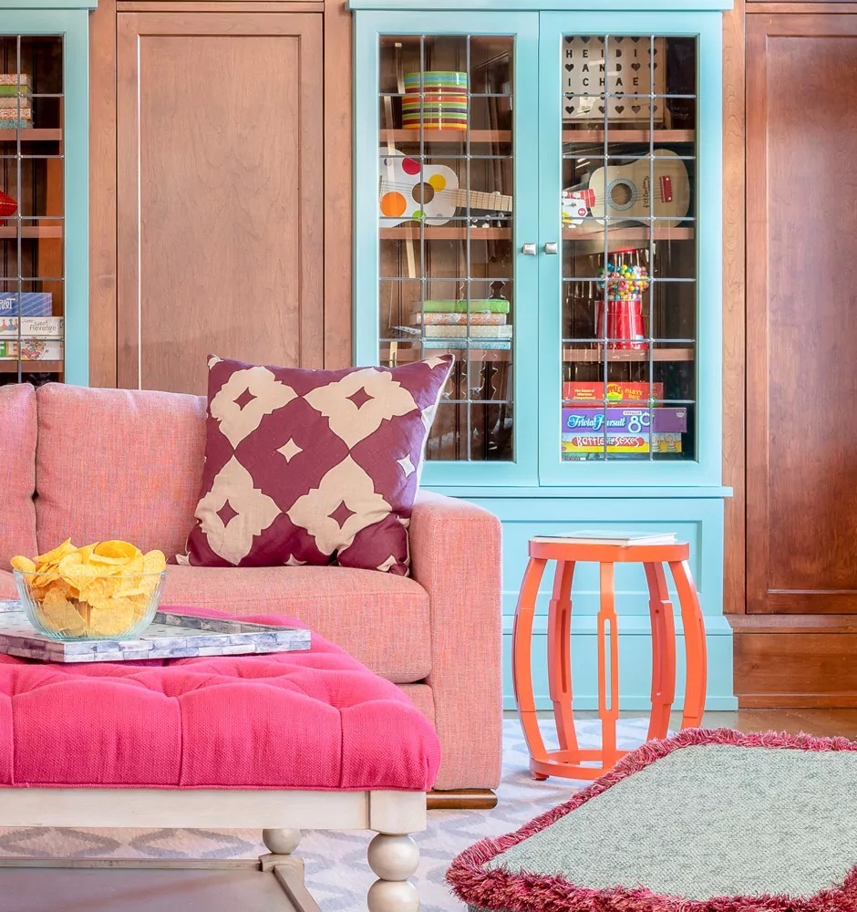 Turquoise Glass-Front Cabinets Display Colorful Games and Toys