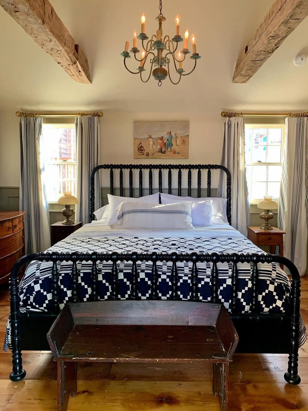 Antique Wooden Bench Adds Rustic Charm at Foot of Bed