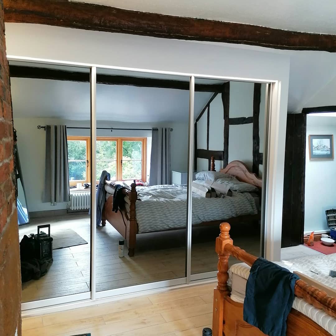 Full-Length Mirrored Doors Reflecting Room Details