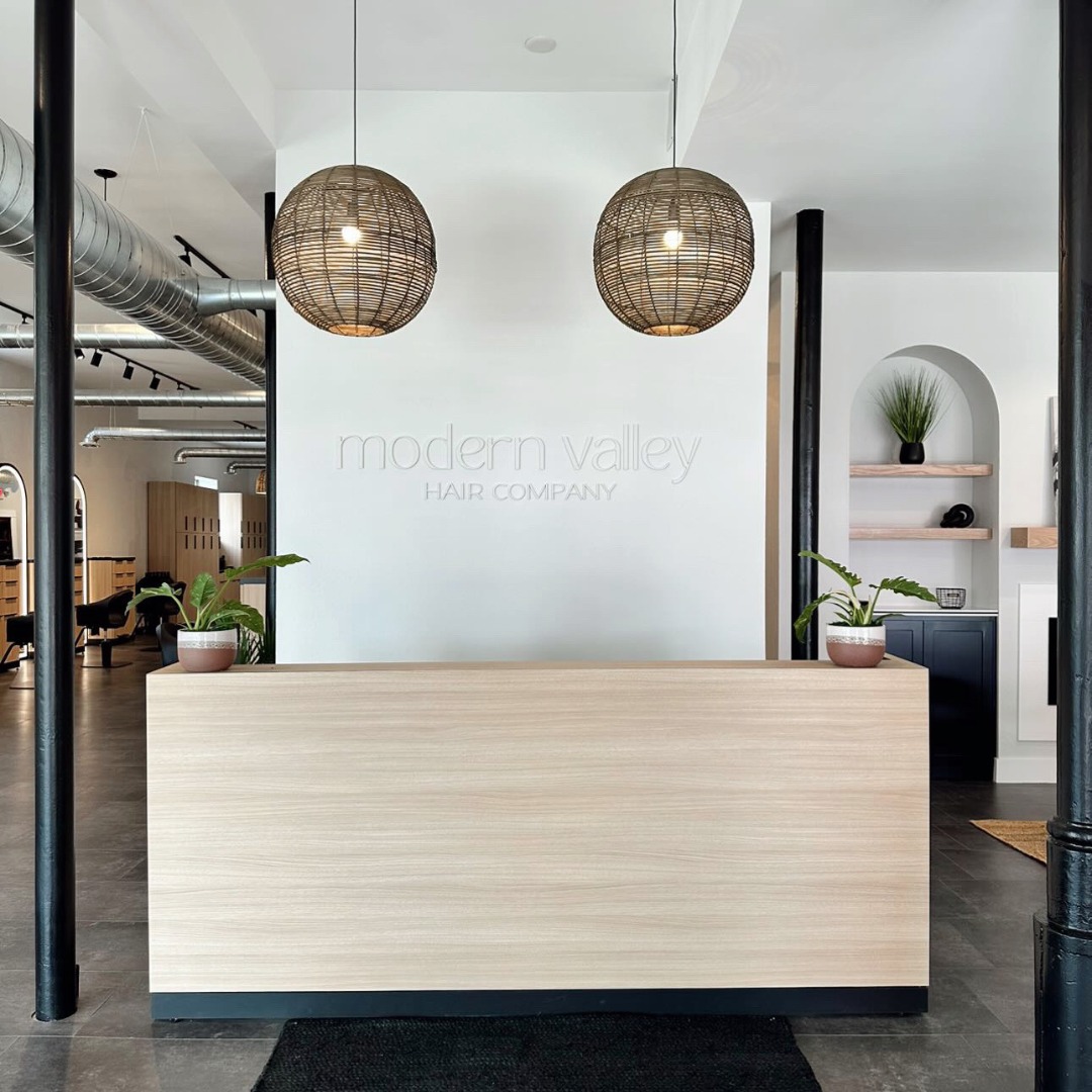 Light Wood Desk with a Black Base for a Clean Statement
