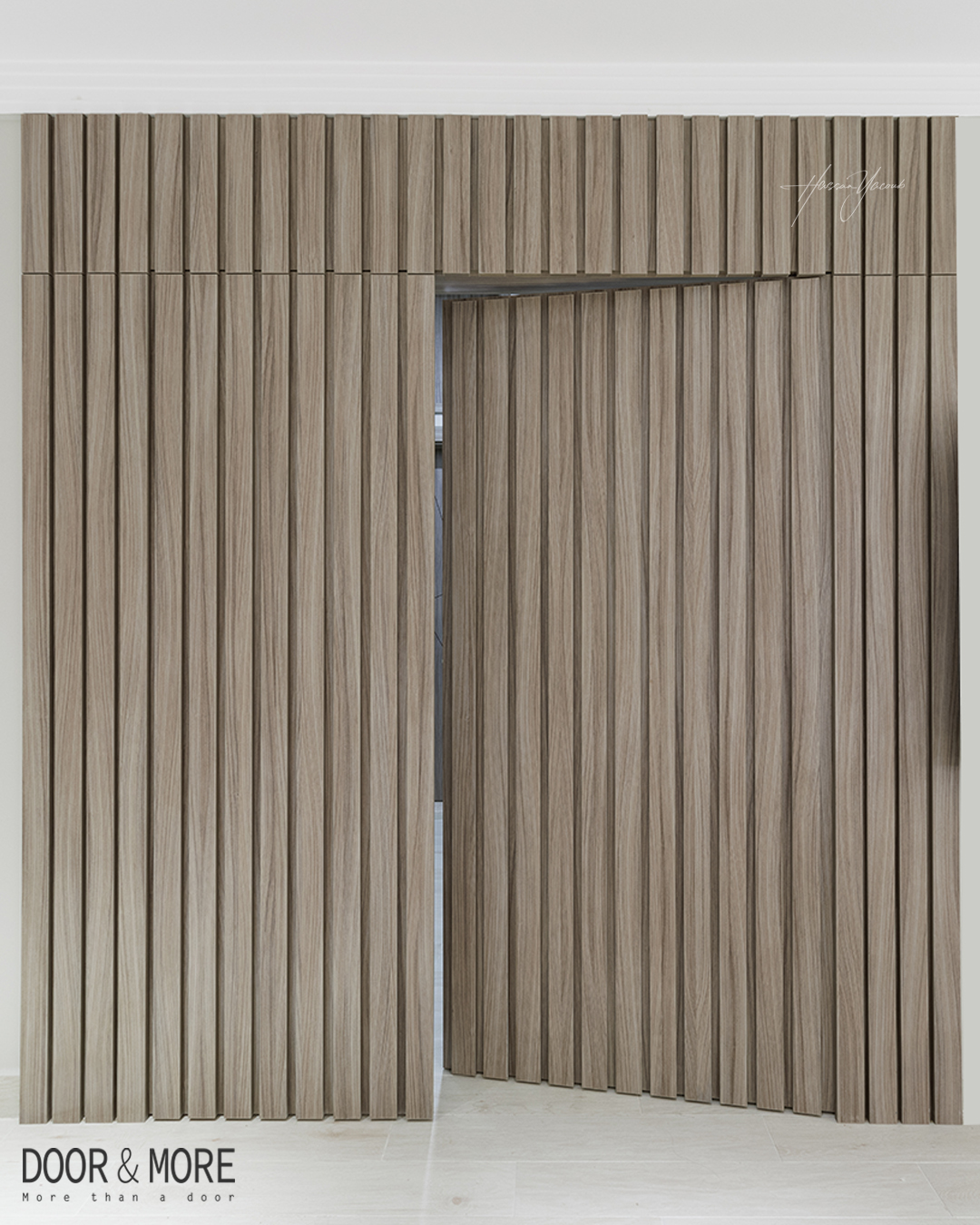 Wood Slat Wall Panels Conceal a Hidden Doorway